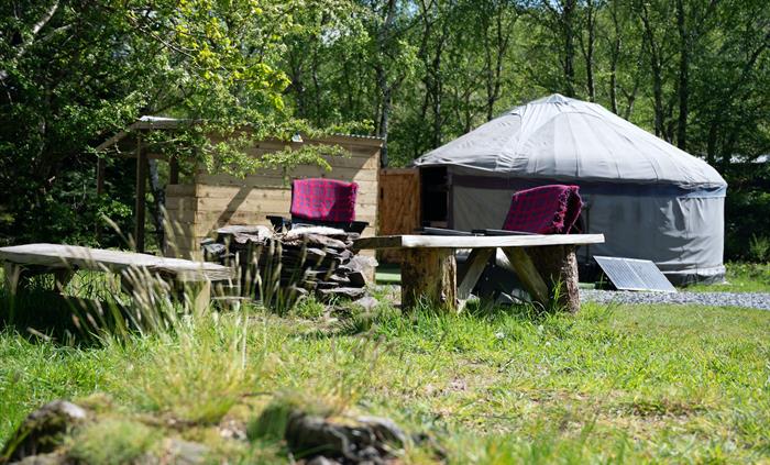 Large yurt with outdoor chairs, Wales yurt holiday